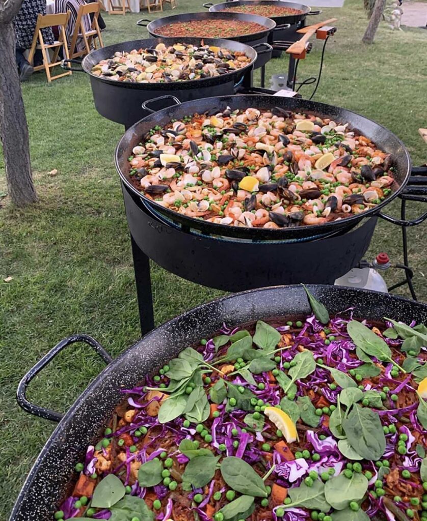 Paella is served from traditional pans.