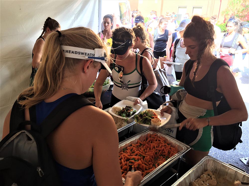 Team members enjoy a buffet delivered by Peak Performance Catering.