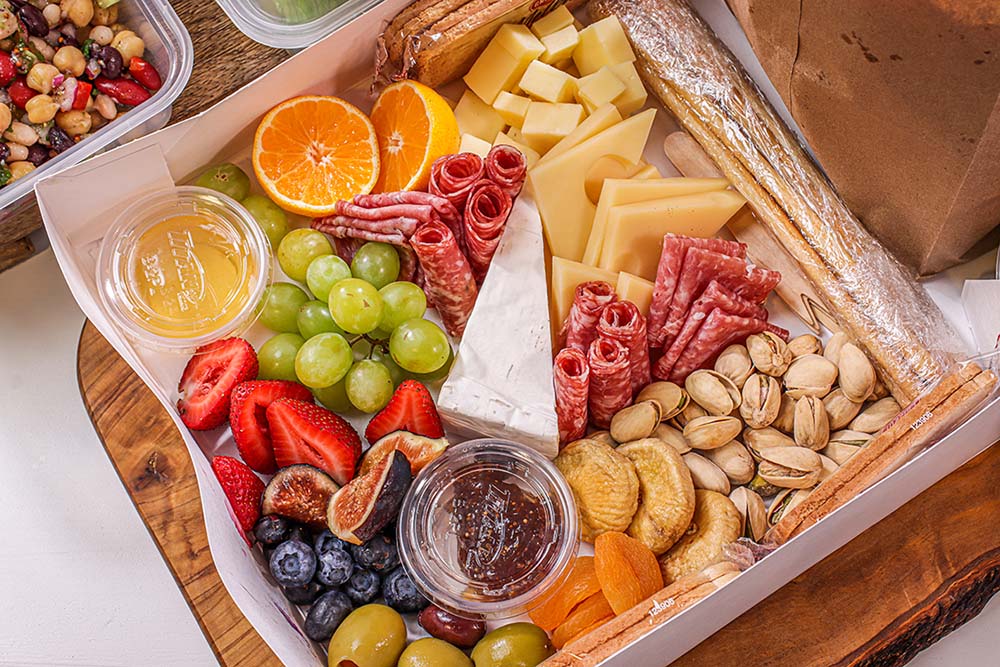 A popular grab-and-go option at Corbin Catering & Foods is artisan cheese and charcuterie in a box.