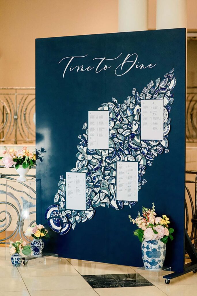 Shades of blue enhance a mosaic seating chart by Samantha Joy Events. Photo by Christen Endicott Photography
