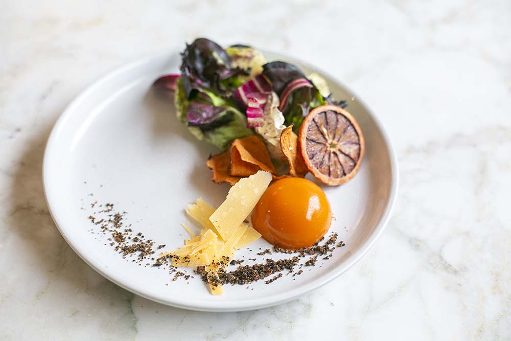 Eatertainment’s clients love the gluten-free Carrot Panna Cotta Salad, with baby red lettuce, spiced orange reduction, gouda and sweet potato chips.