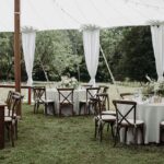 EVL Events often uses sailcloth tents, paired with farm tables and draping. Photo by Sarah Bridgeman Photography