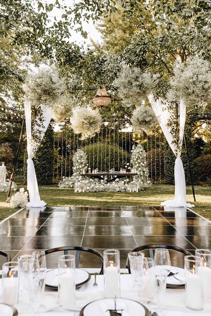 The dance floor takes center stage at a Woven + Revel wedding. Photo by Sydney Marie Photography