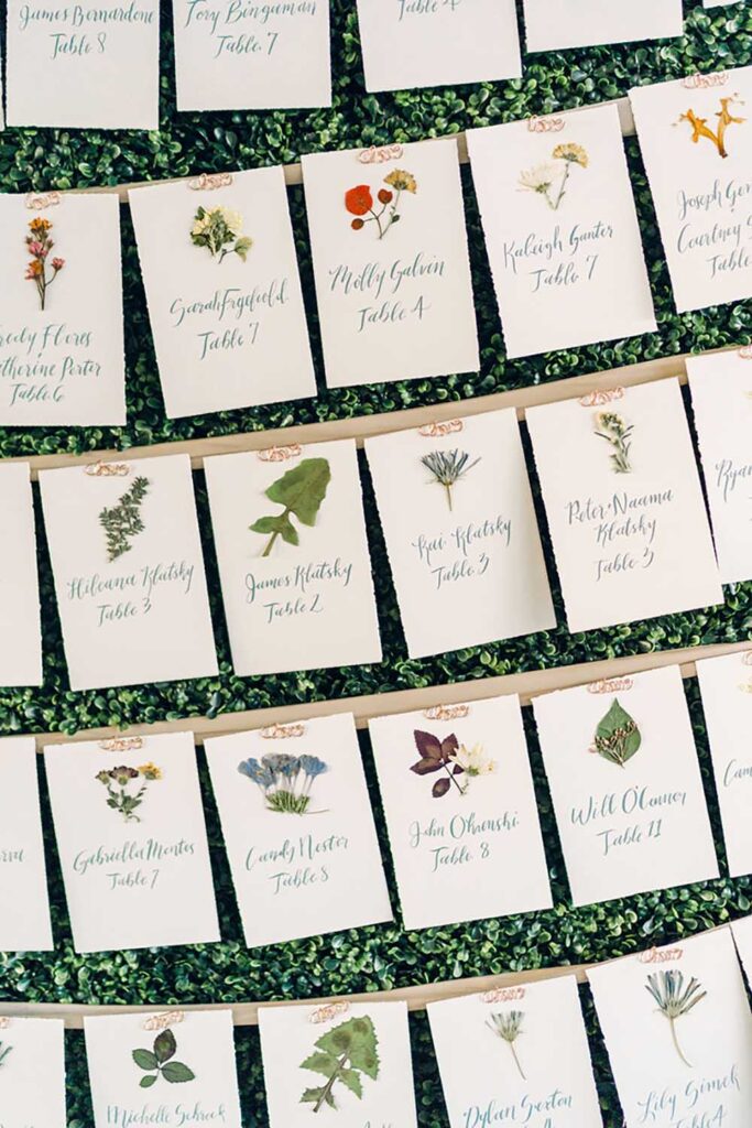 Name cards created by Jaclyn Watson Events feature pressed flowers. Photo by Rodeo & Co.