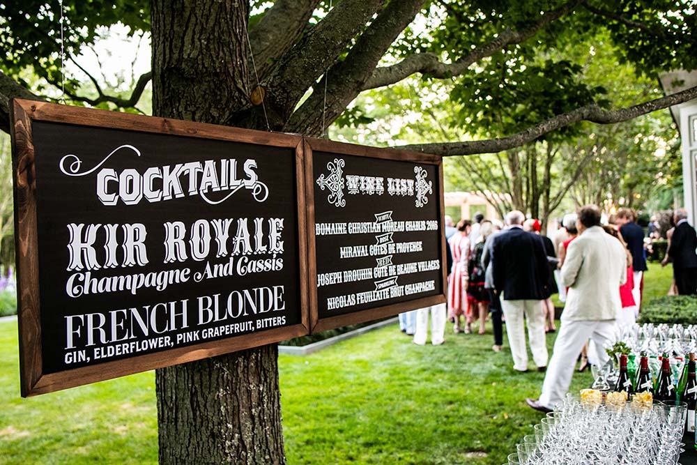 A creatively printed bar menu adds to the ambiance at a Marcia Selden Catering event. Photo by Michael Jurick Photography