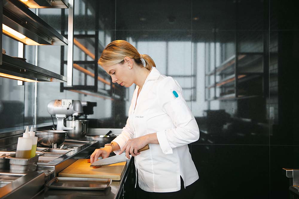 Cornelia Sühr, chef de cuisine, works in the kitchen of the newly reopened Jean-Georges Philadelphia.