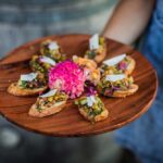 Big Delicious Planet in Chicago incorporates produce and edible flowers from its urban farm in many dishes, including this vegetarian bruschetta. Photo by Madi Ellis Photography