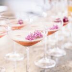 Add eye-catching clusters of flowers to a cocktail for a festive garnish, suggests Melissa Misgen of Elite Events Catering. Photo by Dewitt for Love Photography
