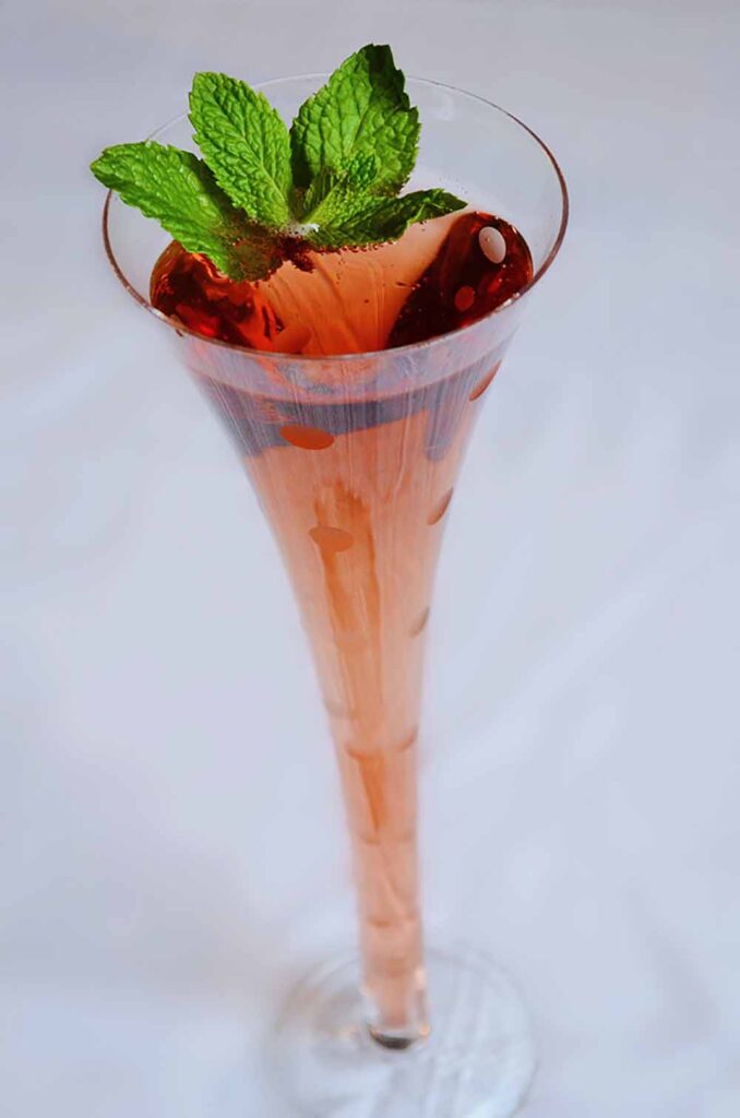 Pom and a sprig of mint add holiday colors to CMPE's Merry Mojito. Photo by Cameron Mitchell Restaurants
