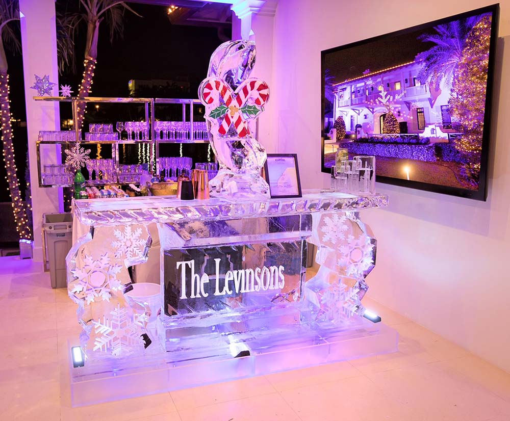 For a holiday event, Craft Cartel commissioned a bar made out of ice blocks, complete with a candy cane luge.