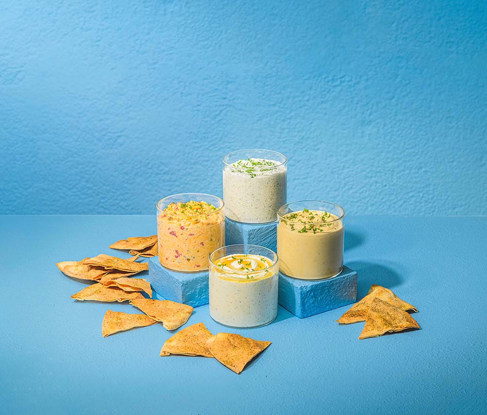 Dips on the Taziki's menu include (clockwise from top) Taziki Dip, Hummus, Whipped Feta and Spicy Pimento Cheese.