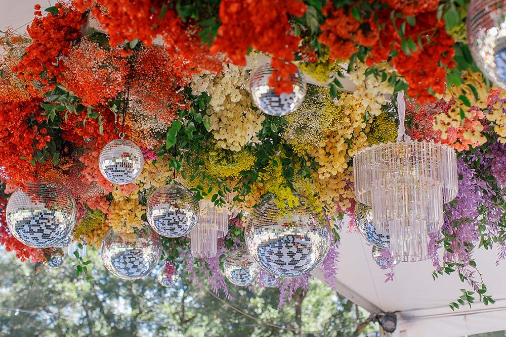 Millennials and Gen Z couples are including nostalgic decor details, such as disco balls. Photo by Caroline's Collective