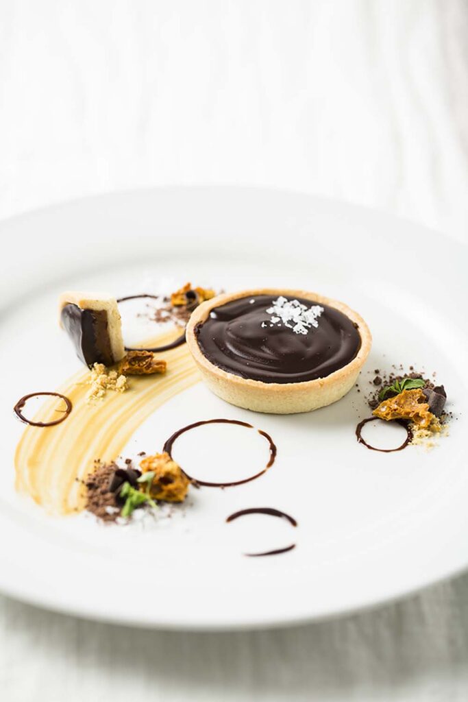 Marcia Selden Catering's carefully crafted desserts include a dark chocolate salted caramel tart. Photo by Robin Selden