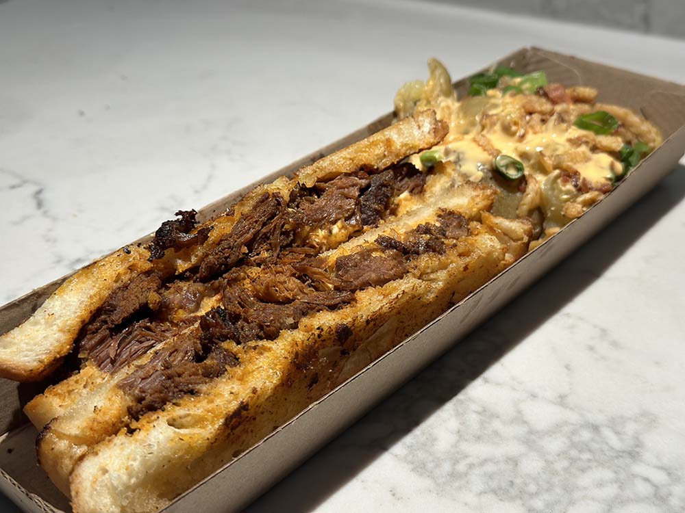 Pimento & Barbacoa Melt with Loaded Smash Potatoes at Enmarket Arena