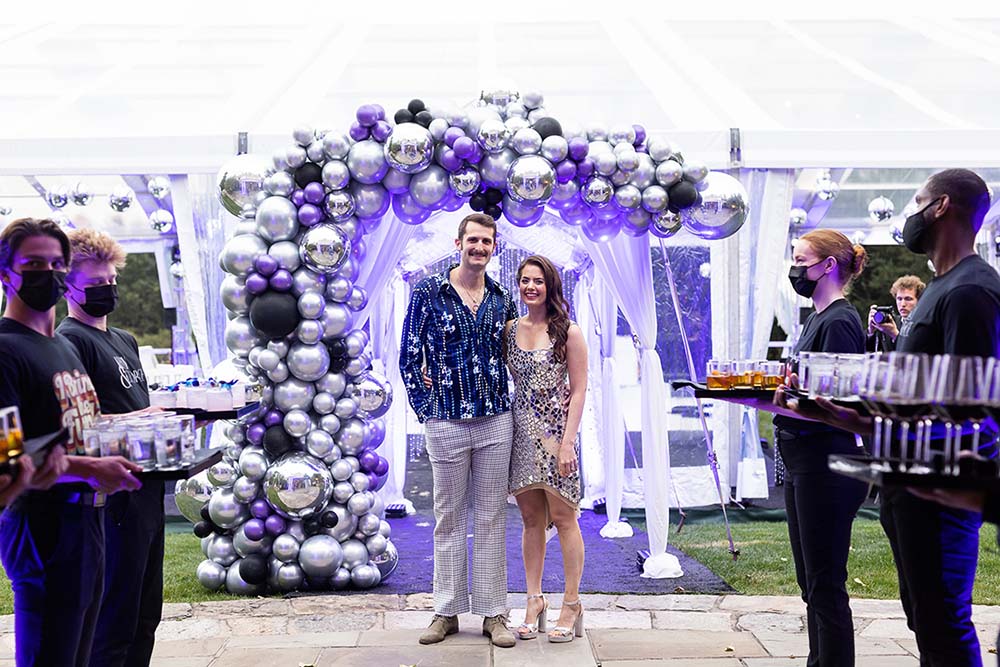 Make your events more Instagram-friendly with balloon arches, such as this glitzy addition to a Marcia Selden Catering wedding anniversary party.