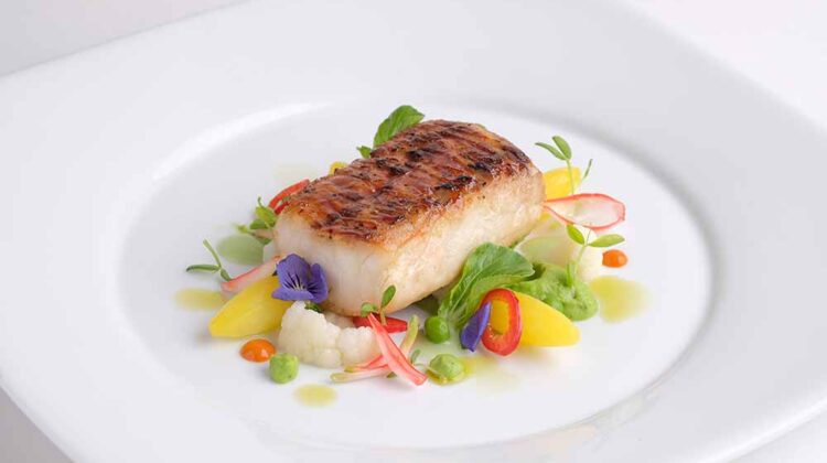 Windows Catering in Washington, D.C., consults the Monterey Bay Aquarium Seafood Watch list to ensure the seafood it serves—such as this halibut dish—is sustainable.