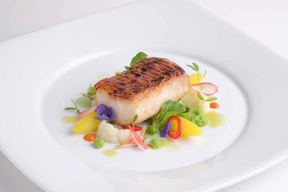 Windows Catering in Washington, D.C., consults the Monterey Bay Aquarium Seafood Watch list to ensure the seafood it serves—such as this halibut dish—is sustainable.